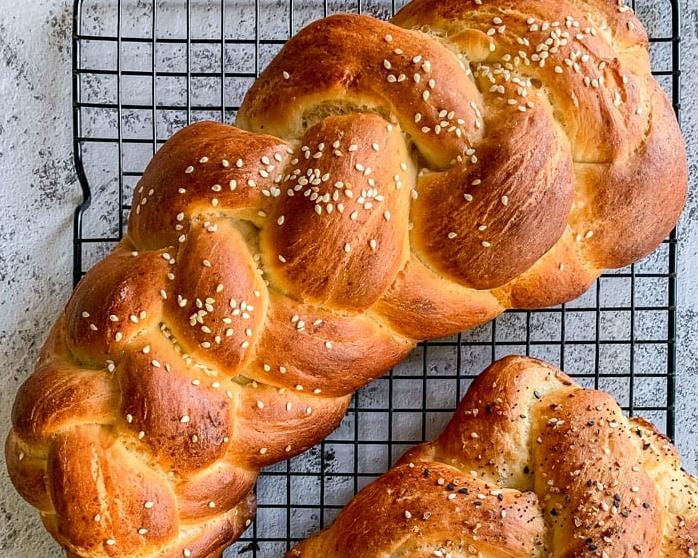  A crispy, golden loaf of vegan challah fresh from the oven