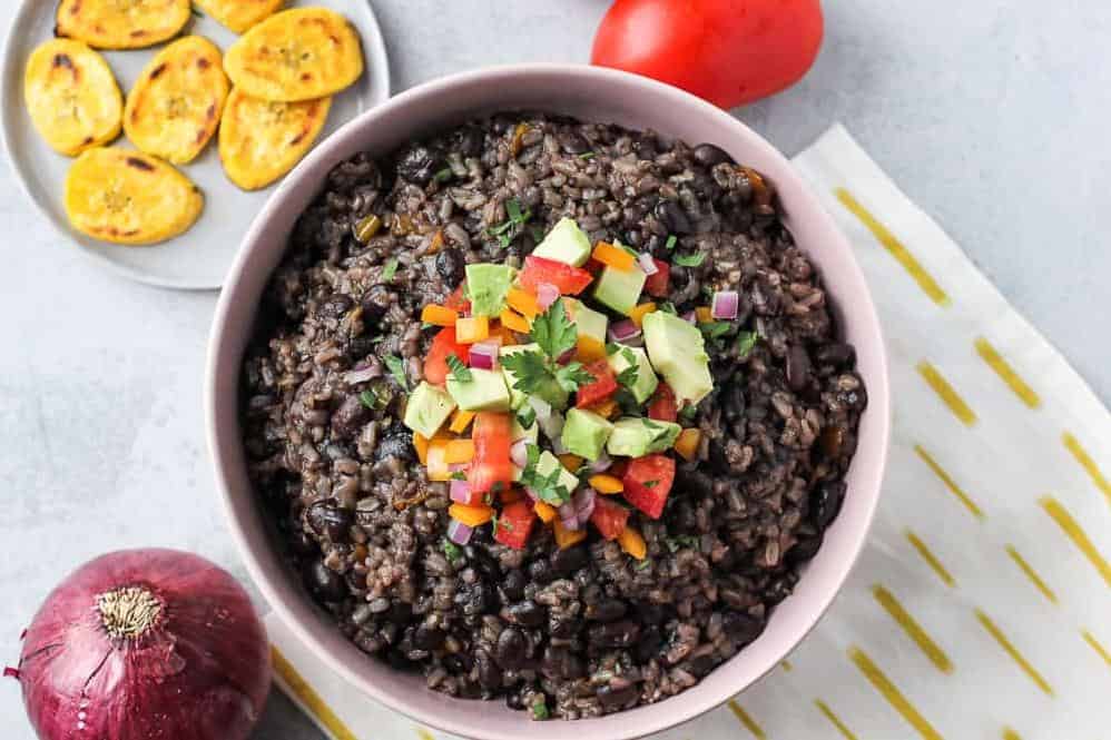  A hearty bowl of Cuban black beans and rice, infused with flavors of the Caribbean