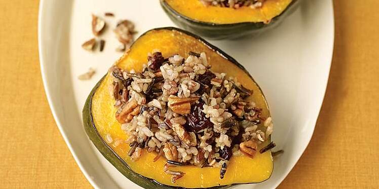  Acorn Squash boats filled with savory wild rice and mushroom stuffing.