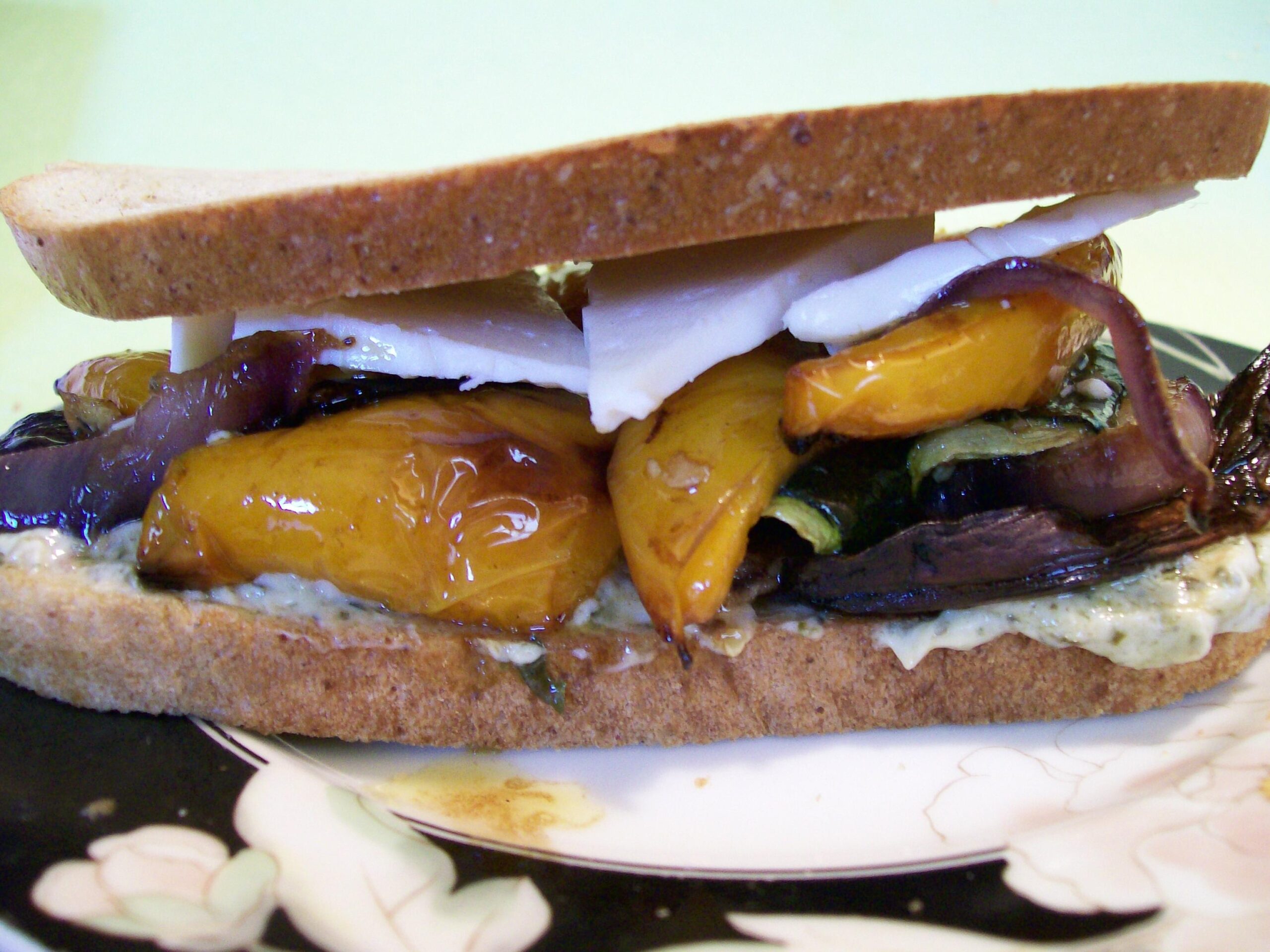  Bite into this delicious and nutritious roasted veggie sandwich with a light and creamy brie cheese spread