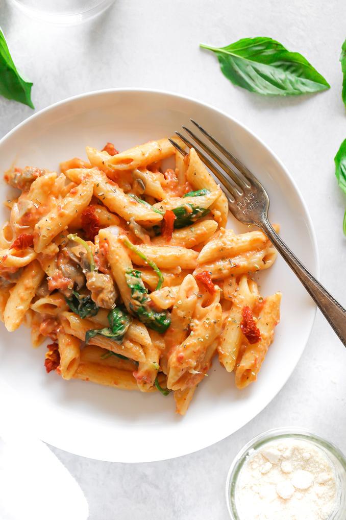  Creamy vegan pasta with a pop of flavor from sun-dried tomatoes and basil.