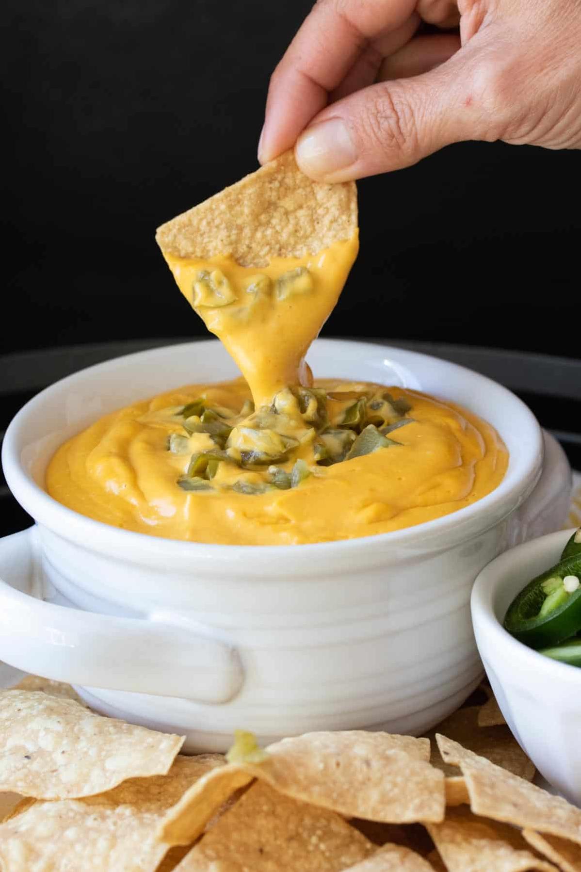  Drizzle our vegan nacho cheese sauce over chips for a tasty snack!