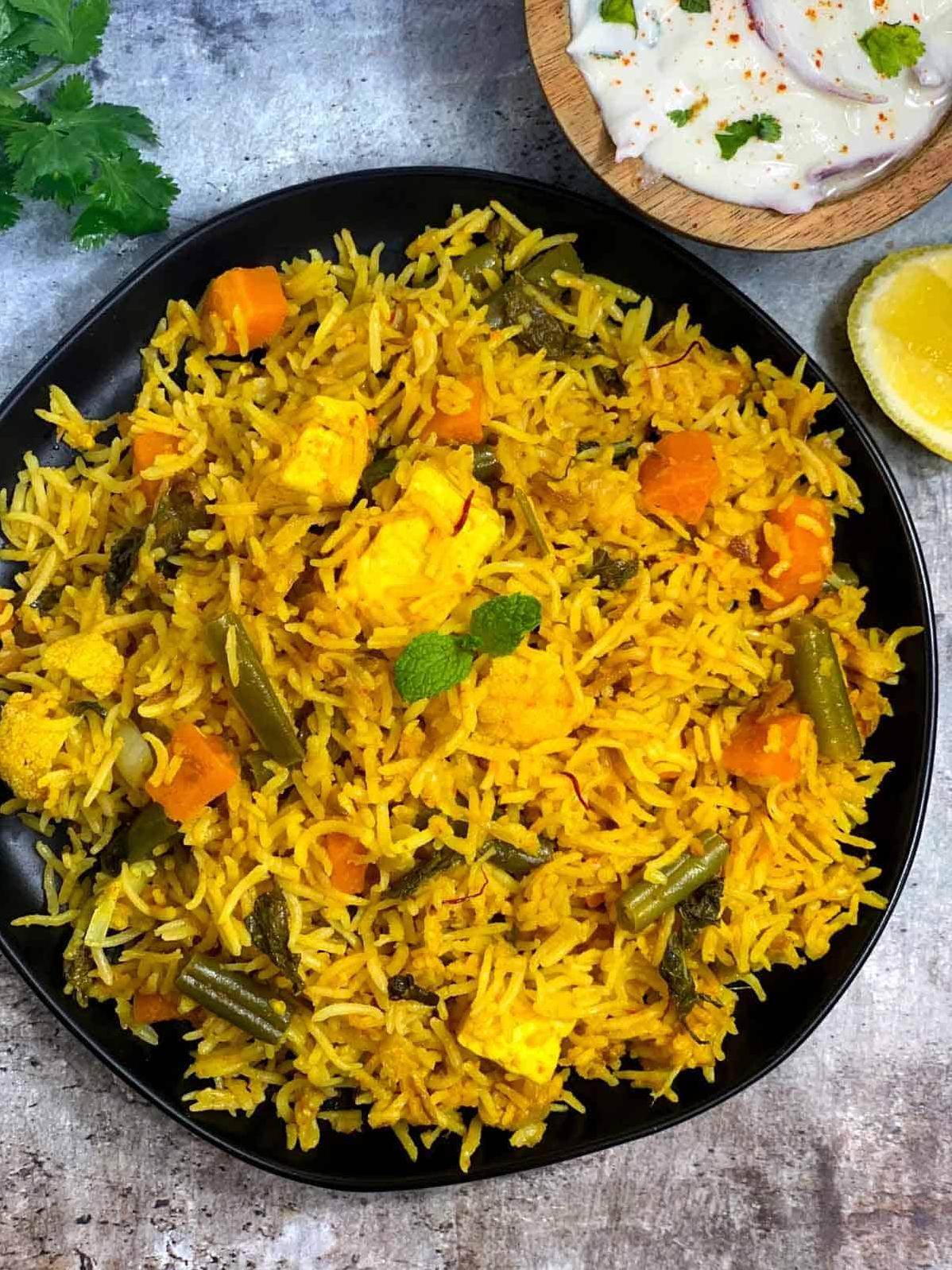  Eat the rainbow with this vibrant, layered and flavorful vegetarian biryani!