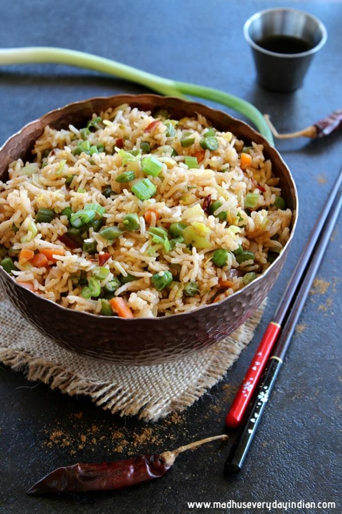  Fresh ginger and garlic add a depth of flavor that takes this fried rice to new heights.