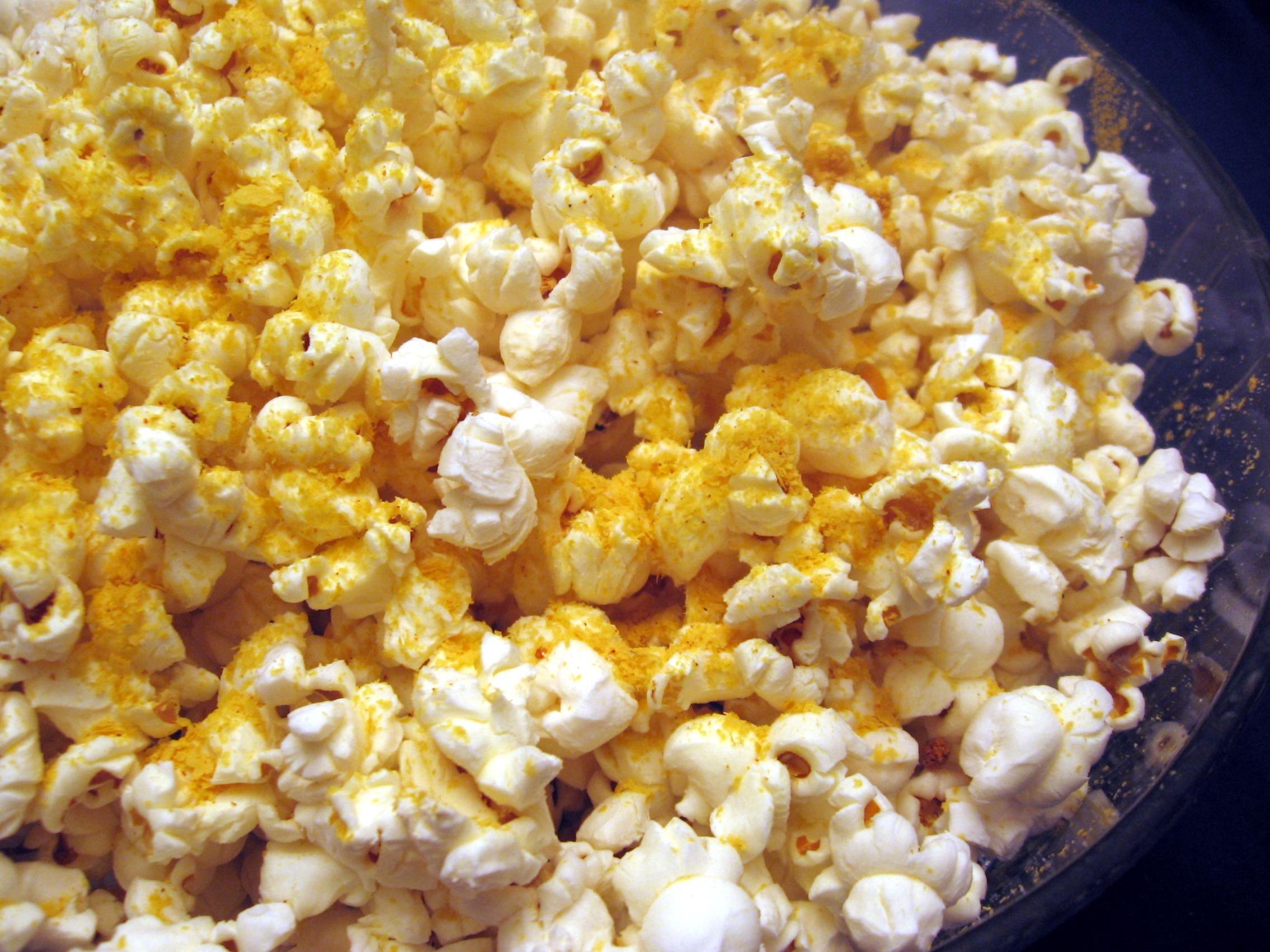  Get ready for a deliciously cheesy movie night with this vegan Cheezy Popcorn recipe!