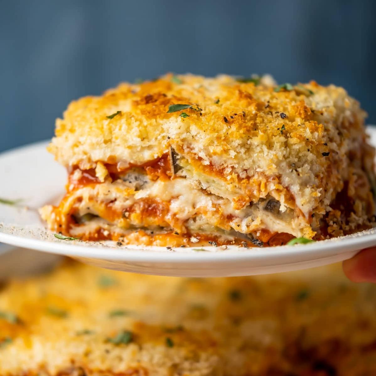  Get ready for a mouth-watering explosion of flavors with this cheesy Vegan Eggplant Parmigiana!