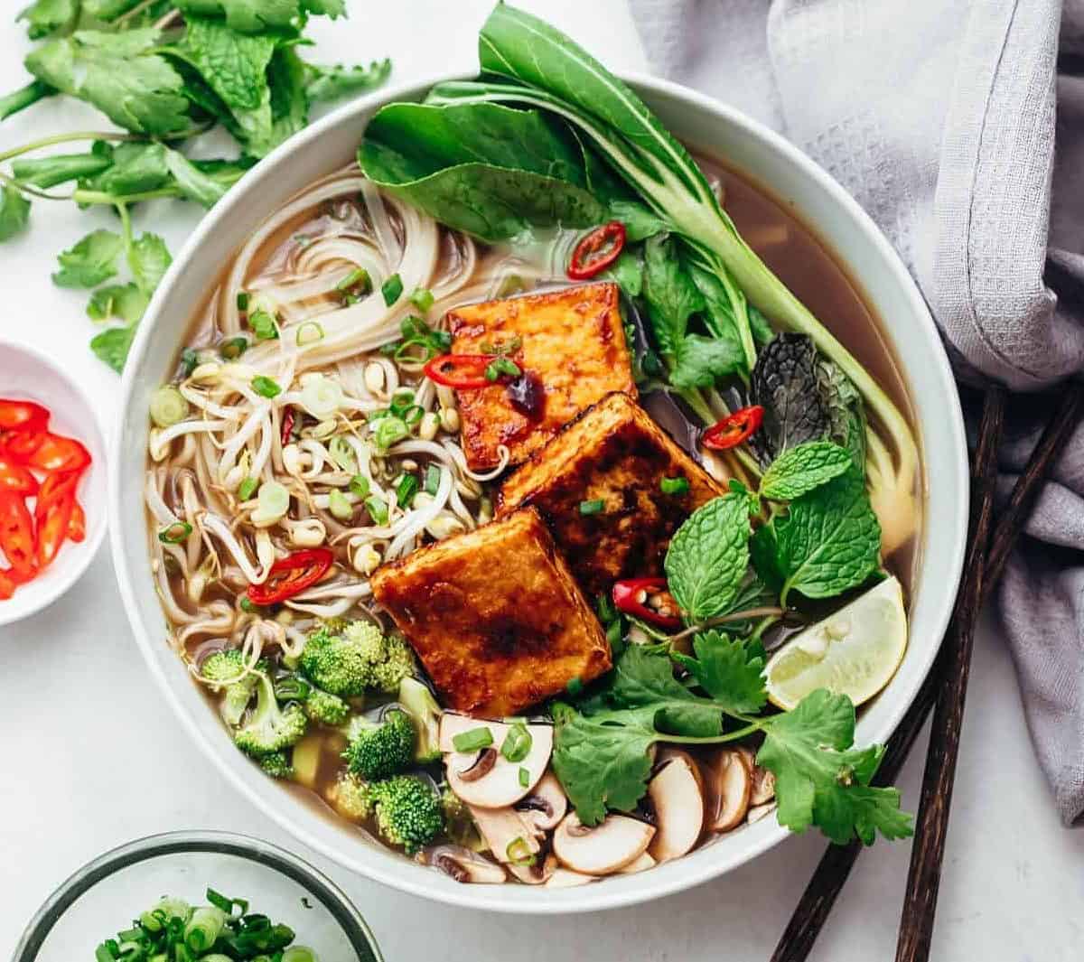  Impress your guests with this Vietnamese broth topped with fresh herbs and veggies.