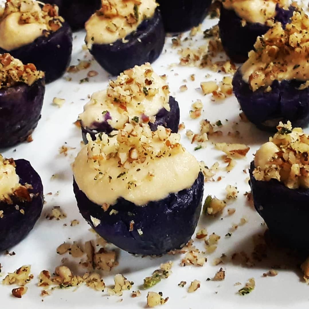  Indulge in a velvety cashew cream topping with vibrant purple potatoes.