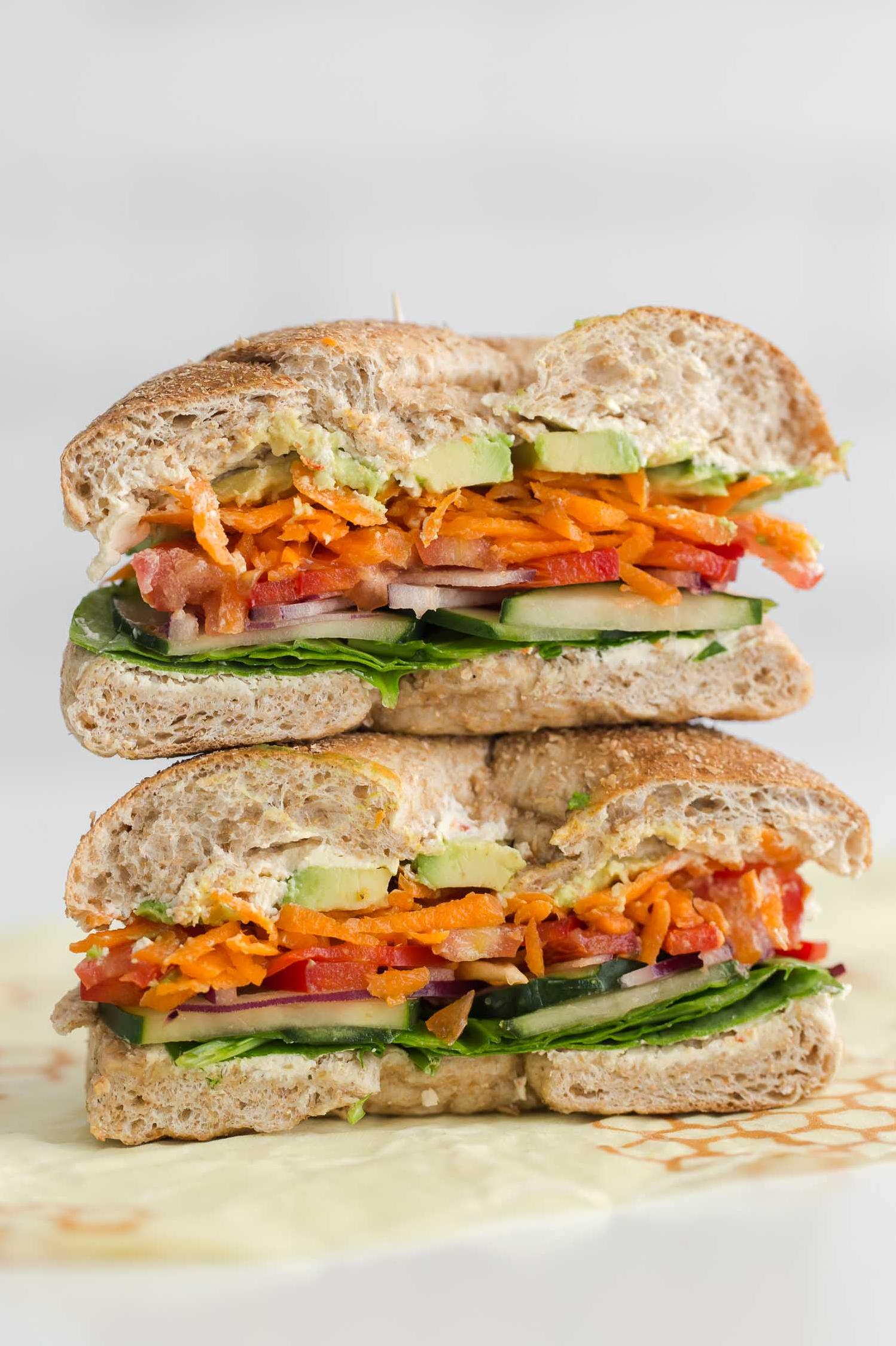  Make your morning a little brighter with this colorful veggie bagel sandwich.