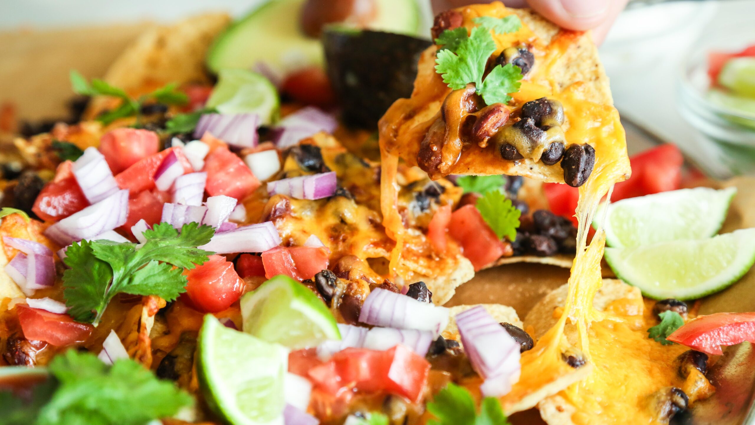  Perfectly crunchy chips, smothered in melted vegan cheese and topped with hearty black beans