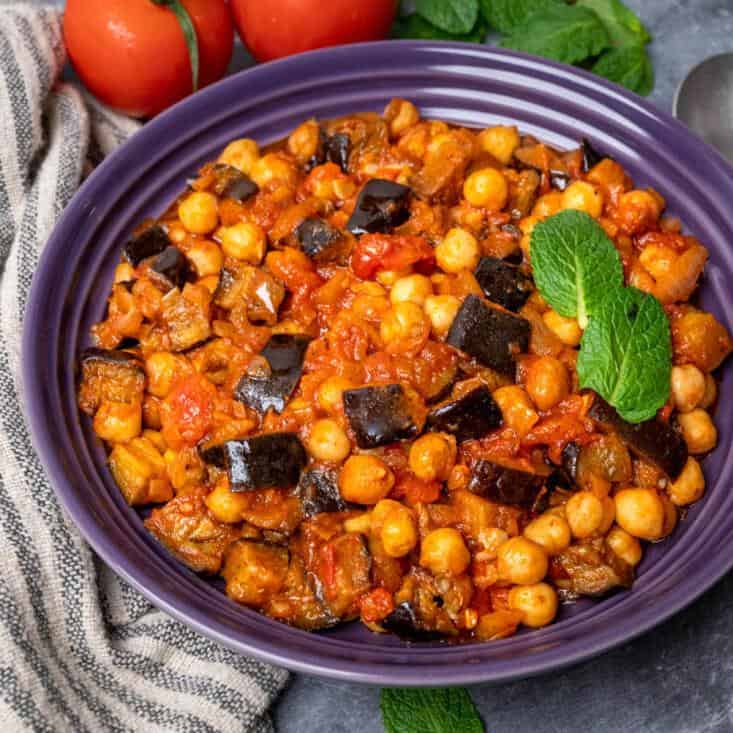  Sizzling eggplant, hearty chickpeas, and tangy tomatoes unite in this vegan version of the Lebanese classic.