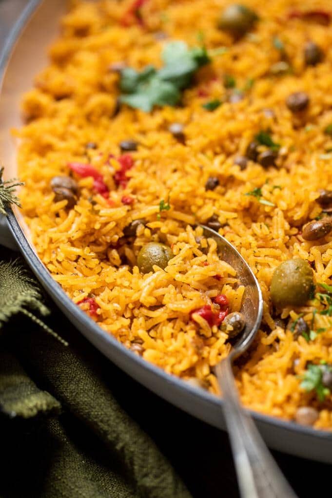  Take your taste buds on a tropical vacation with Arroz Con Gandules.