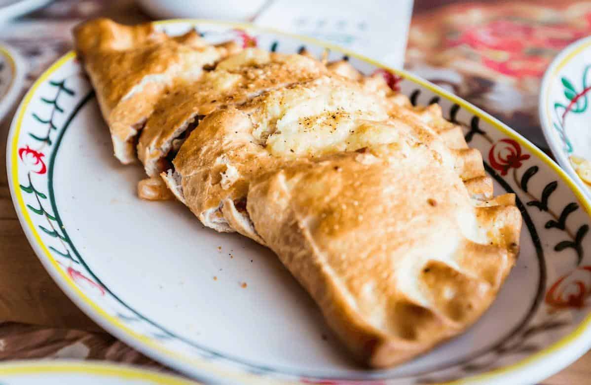  This vegan calzone is filled with plant-based protein and nutritious veggies for a satisfying meal.